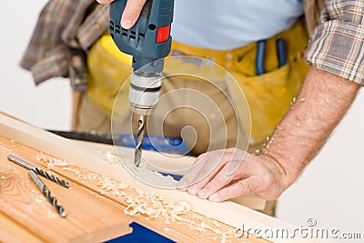 Home improvement - handyman drilling wood Stock Photo