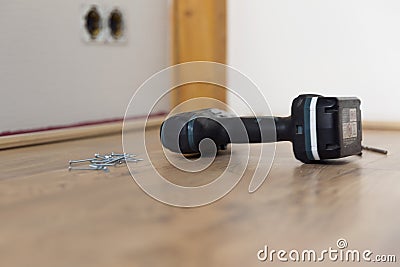 Home improvement. Installing floor moldings. Tools on floor Stock Photo