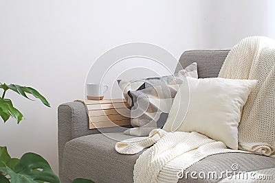 Home interior Cozy Living room Sofa Cushion Coffee mug Knitted p Stock Photo