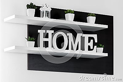Home letters decor on white shelf Stock Photo