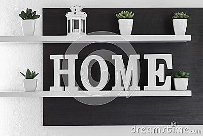 Home letters decor on white shelf Stock Photo