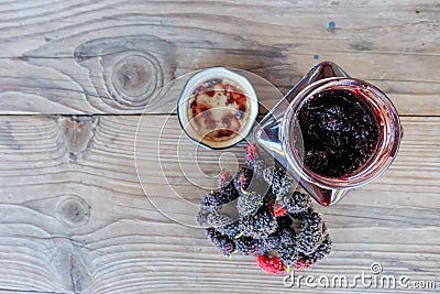 Home made mulberry jam and fresh mulberry on wood background, Healthy eating and very useful Stock Photo