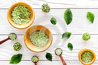 Home made spa cosmetic with tea olive herbs and salt for bath on white background top view pattern Stock Photo