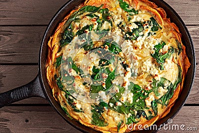 Home made Spinach quiche in a sweet potato crust with feta cheese Stock Photo