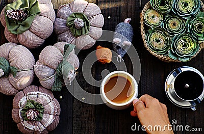 Home morning coffee time, green rose, handmade pumpkin for autumn ornament, yarn for knit Stock Photo