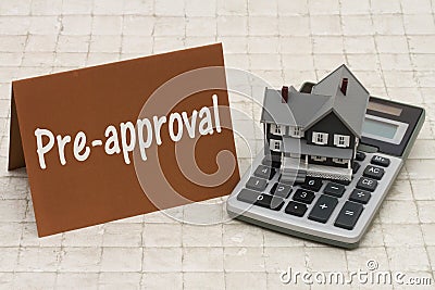 Home Mortgage Pre-approval, A gray house, brown card and calculator on stone background Stock Photo