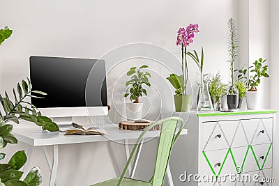 Home office with commode and flowers Stock Photo