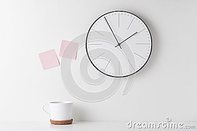 Home office minimal workspace desk with wall clock Stock Photo