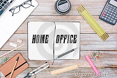 Home Office written in notepad on table Stock Photo