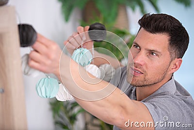 home owner putting up lights Stock Photo