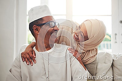 Home portrait, Muslim and elderly couple laughing at funny conversation, humour and care in retirement, bonding or Stock Photo