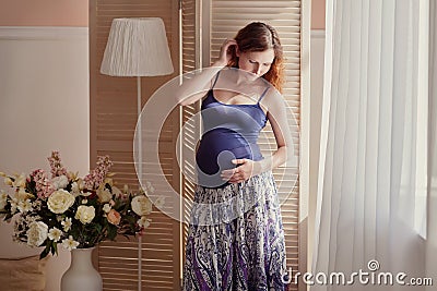 Home portrait of pregnant woman Stock Photo