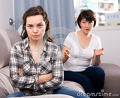 Home quarrel between friends woman Stock Photo