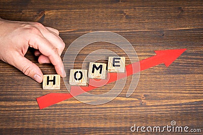 HOME. Real Estate, Family and Remote Work Concept. Red arrow indicates the development and growth Stock Photo