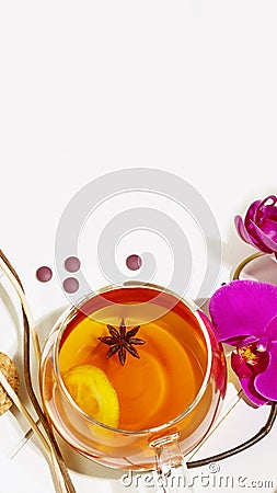 Fruit tea with lemon slice, aroma sticks and orchids with copy space Stock Photo