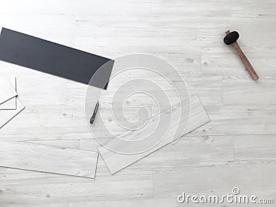 Home renovate. White Wood vinyl laminate Flooring Installation Stock Photo