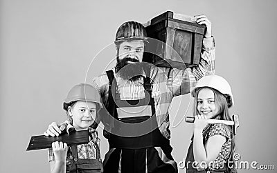 Home renovation. Create room you really want live. Follow father. Father builder kids girls. Teach daughter. Informal Stock Photo