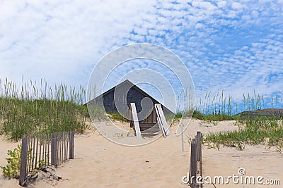 Home roof behind sand dunes 2 Editorial Stock Photo