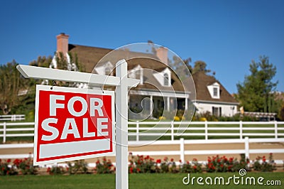 Home For Sale Real Estate Sign and House Stock Photo