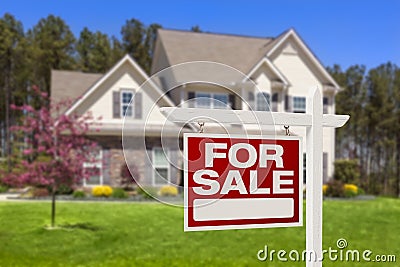 Home For Sale Real Estate Sign and House Stock Photo