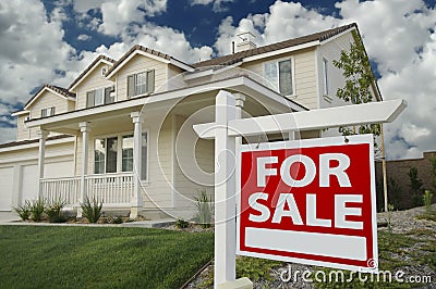 Home For Sale Sign and House Stock Photo