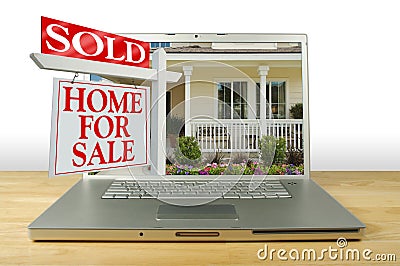 Home for Sale Sign on Laptop Stock Photo