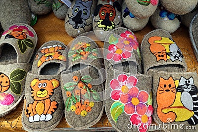 home slippers made of felted wool with a variety of colored appliquÃ©s Stock Photo