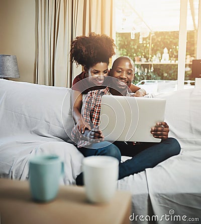 Home, smile and black couple with laptop, love and connection with internet, relaxing and lens flare. Apartment Stock Photo