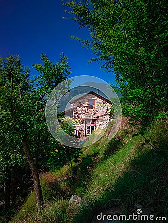 A house of stone masonary at countryside in the mountains Stock Photo