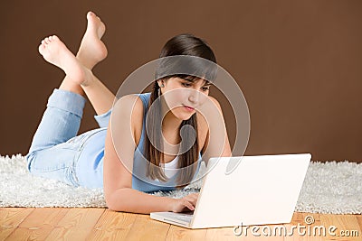 Home study - woman teenager with laptop Stock Photo