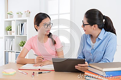 Home tutor explaining school education content Stock Photo