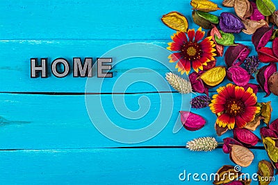 Home word on blue wood with flower Stock Photo