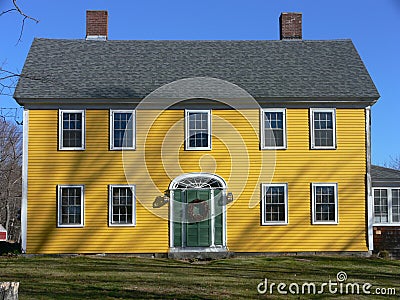 Home: yellow house green door Stock Photo