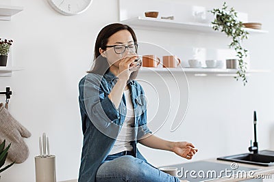 Homebody recovering water balance on hot day in apartment Stock Photo