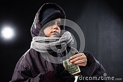 Homeless beggar boy winter people. lonely city Stock Photo