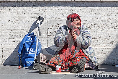 Homeless beggar. Woman asking for alms. Street. Rome Italy Editorial Stock Photo