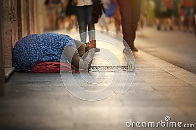 Homeless beggar. Woman asking for alms. Street. Rome Italy Stock Photo