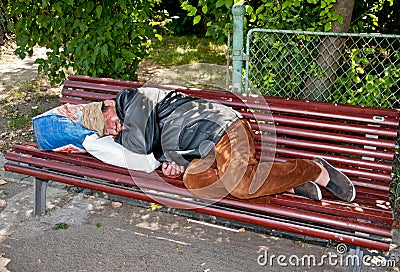 Homeless on the bench Editorial Stock Photo