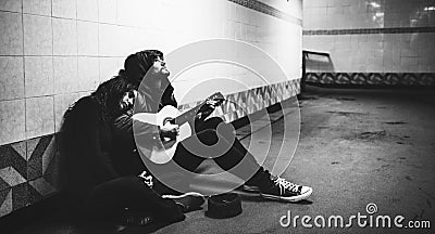 Homeless Couple Man Playing Guitar Asking For Money Donation Stock Photo