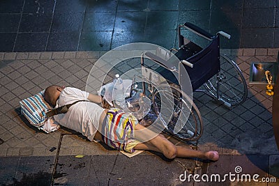 Homeless and disabled person on the street of Bangkok, Thailand. Editorial Stock Photo