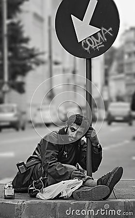 Homeless Sad Man on Bucharest streets Editorial Stock Photo