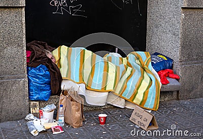 Homeless male getting to sleep Editorial Stock Photo