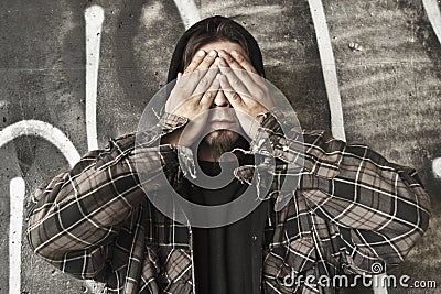 Homeless man see no evil Stock Photo