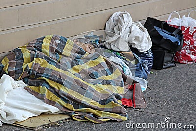 Homeless person sleeping on street Editorial Stock Photo