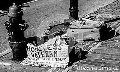 Homeless Veteran sign and belongings on Boston city street Editorial Stock Photo