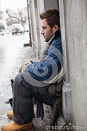 Homeless Young Man Begging In Street Stock Photo