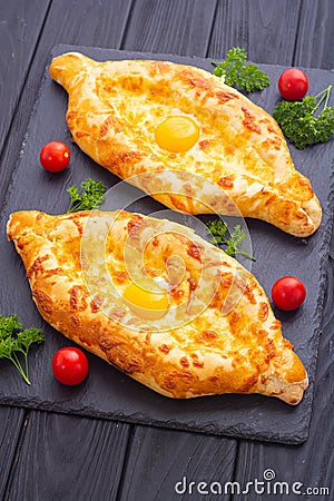 Homemade adjarian khachapuri with egg Stock Photo