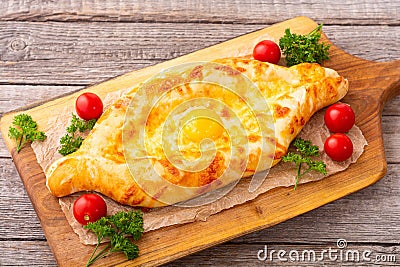 Homemade adjarian khachapuri with egg Stock Photo