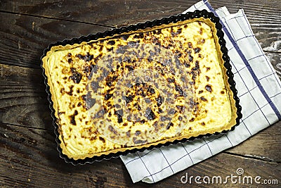 homemade algerian cheese quiche on wood table Stock Photo