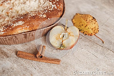 Homemade apple pie and cinnamon on vintage wooden background texture. Top view. Copy, empty space for text Stock Photo